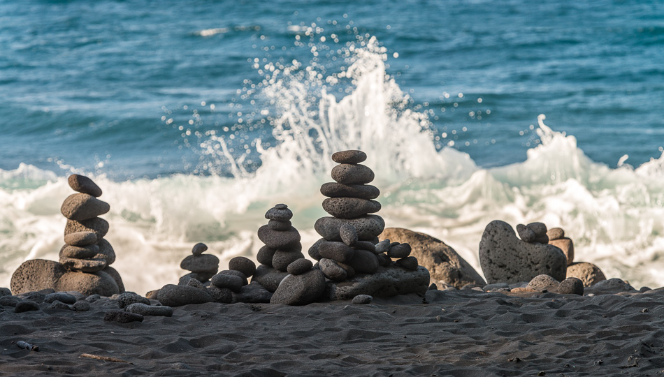 Rocks stacked on the Waipio Valley Black Sand Beach